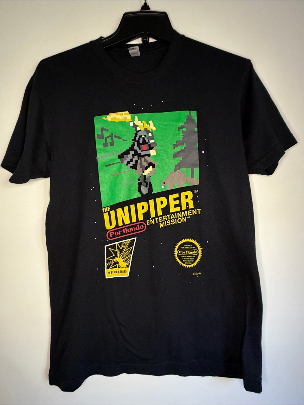 Black Unisex Unipiper Graphic Tee with Yellow & Green Retro Pixel Design